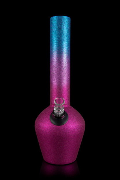 A vibrant pink and blue glass water pipe (bong) with a clear glass bowl, isolated on a black background.