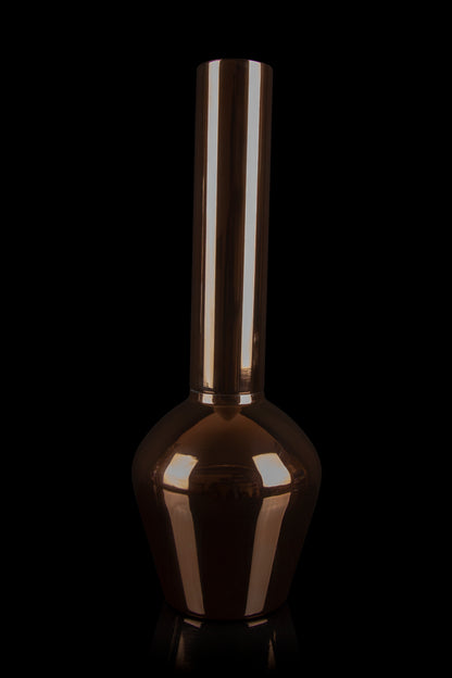 Copper-colored glass bong against a black background.