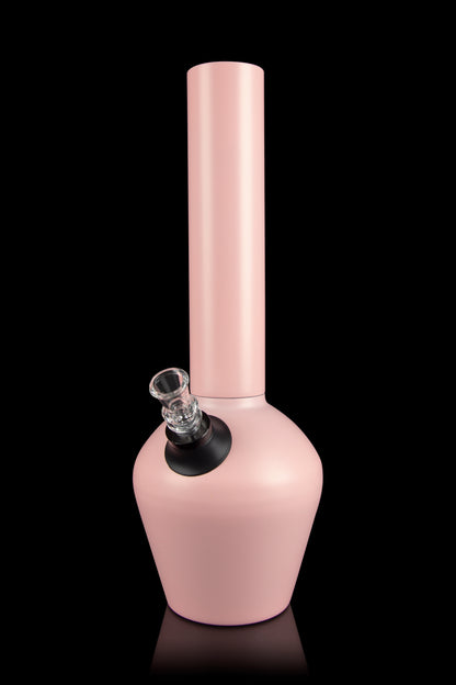 Pink glass water pipe with a clear glass bowl on a black reflective surface.
