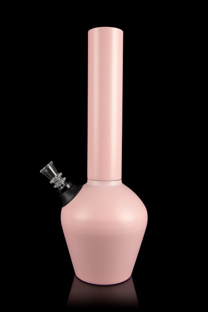 Pale pink glass water pipe (bong) with a glass bowl piece, studio shot on a black reflective surface.