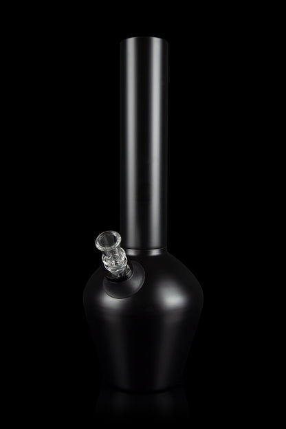 Black glass water pipe (bong) with a clear glass bowl against a dark background.