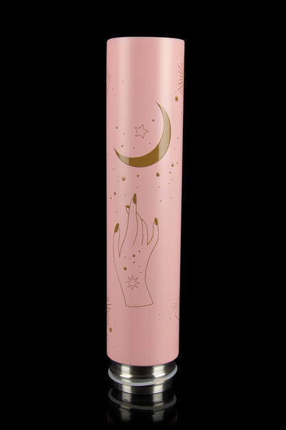 Pink cannabis accessory tube with gold celestial and hand designs.