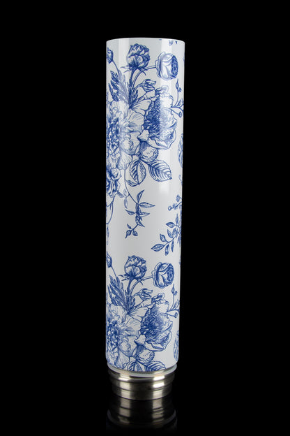 Blue and white floral patterned glass pipe with metal mouthpiece.