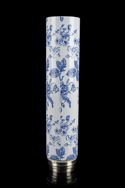 Ceramic cannabis pipe with blue floral pattern on white background.