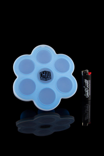 Front view of the Chill Steel Pipes Ice Cube Tray - 2 Pack, showing a blue silicone mold with circular indentations on a white surface.