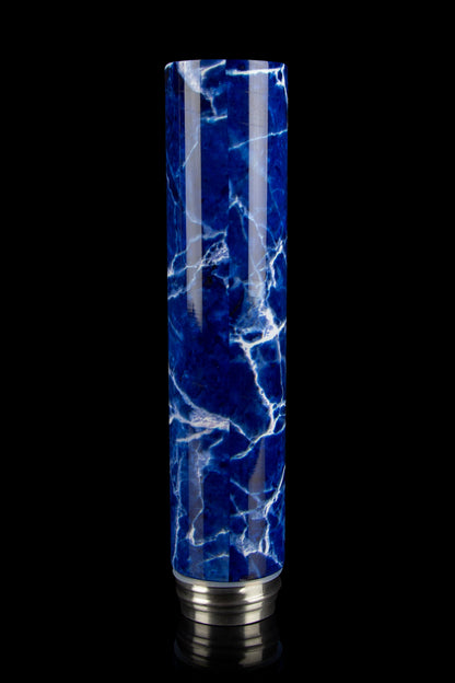Blue marbled glass bubbler with silver base, isolated on black.