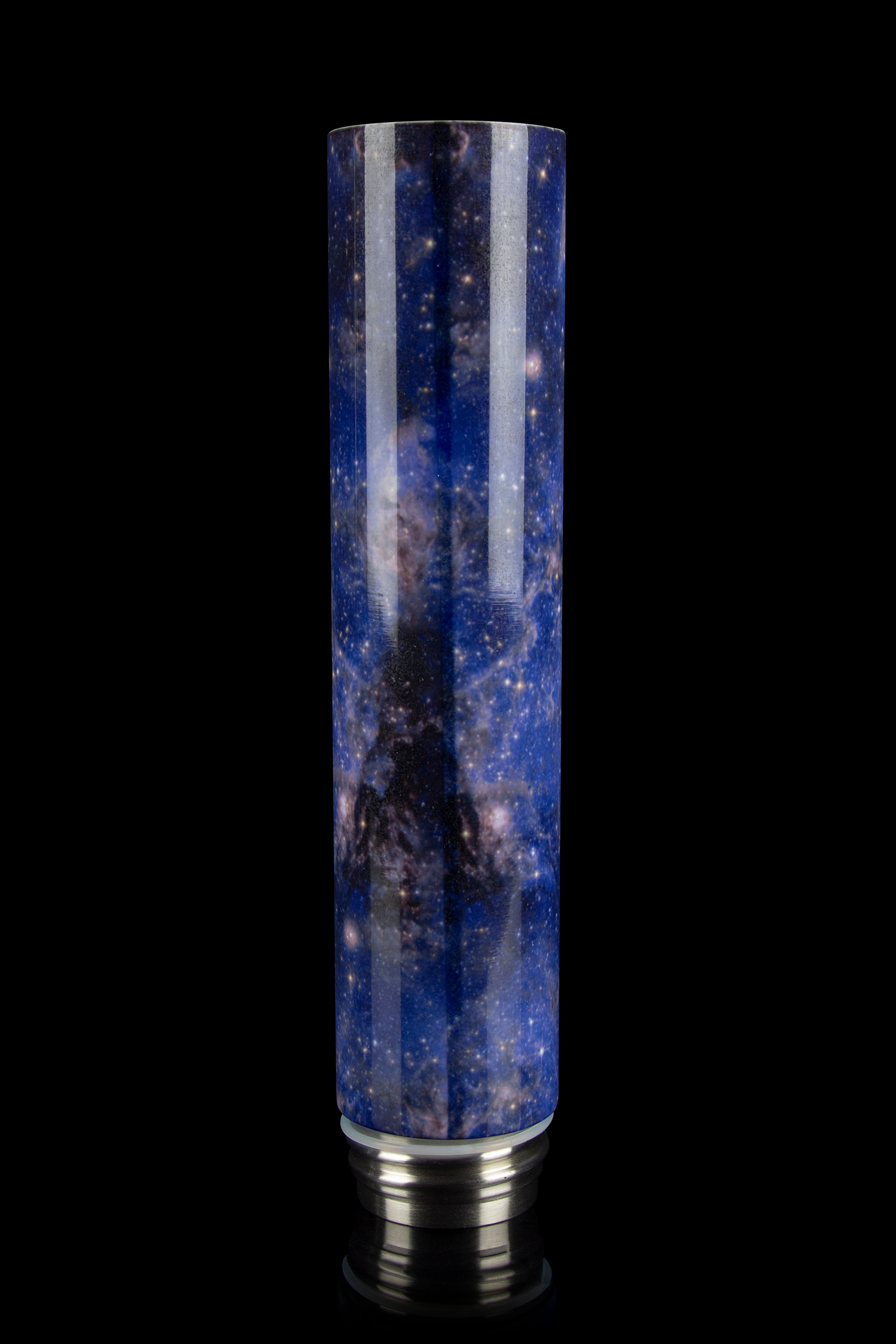 A tall, cylindrical glass tube with a vibrant nebula-inspired design, capped with a silver metallic base, likely a cannabis water pipe or bubbler.