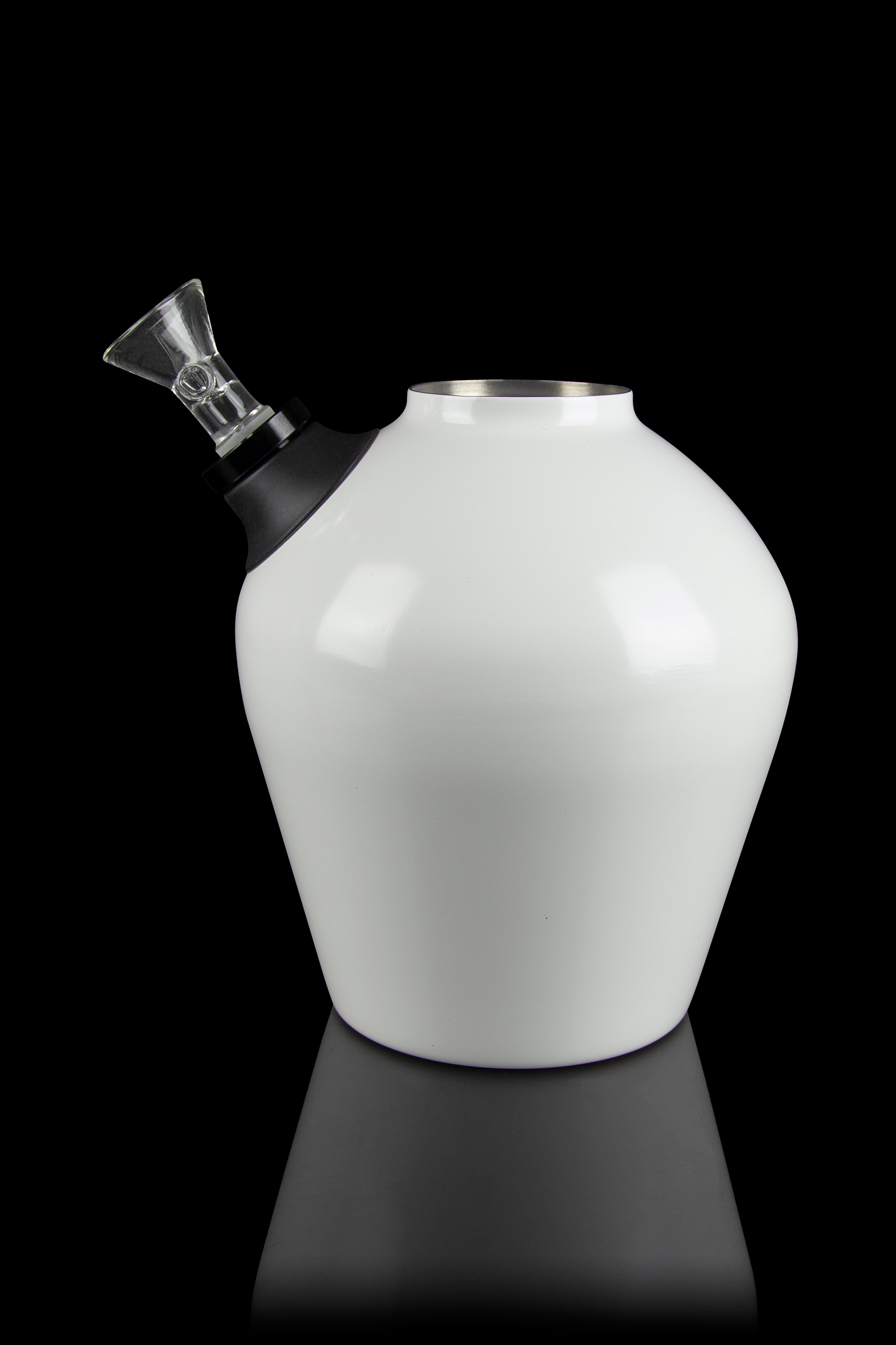 White glass water pipe with a black mouthpiece and clear glass downstem, studio shot on a reflective surface.