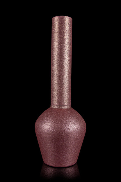 A textured, burgundy glass bong with a bulbous base and a long, slender neck, set against a black background with a reflective surface.