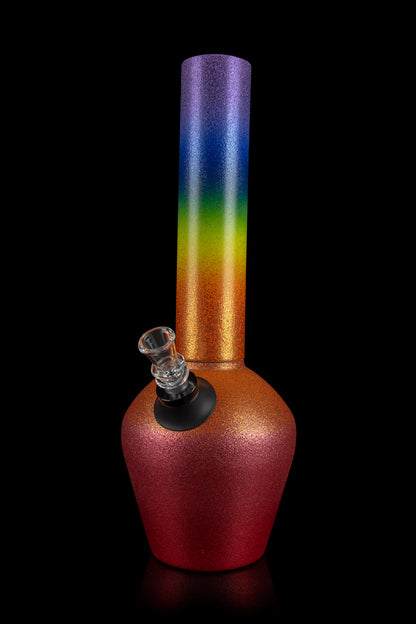 A colorful glass water pipe (bong) with a gradient of red, orange, yellow, green, and blue, isolated on a black background.