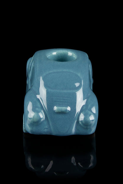 Teal glass sculpture of a vintage Volkswagen Beetle, functioning as a water pipe with visible bowl and mouthpiece.