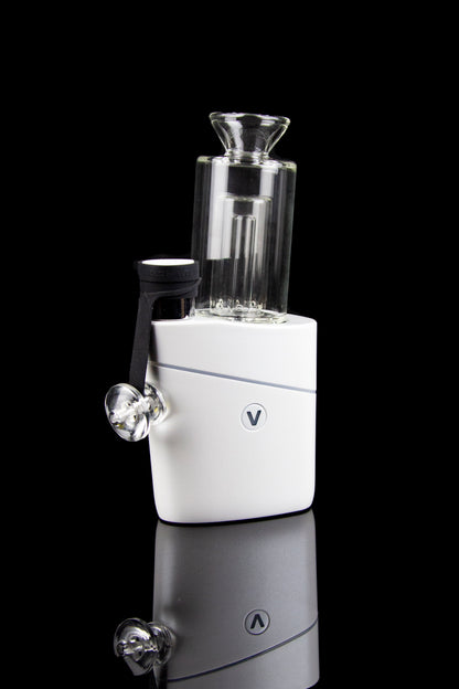 White and silver electronic dab rig with a glass water pipe attachment, displayed against a black background.