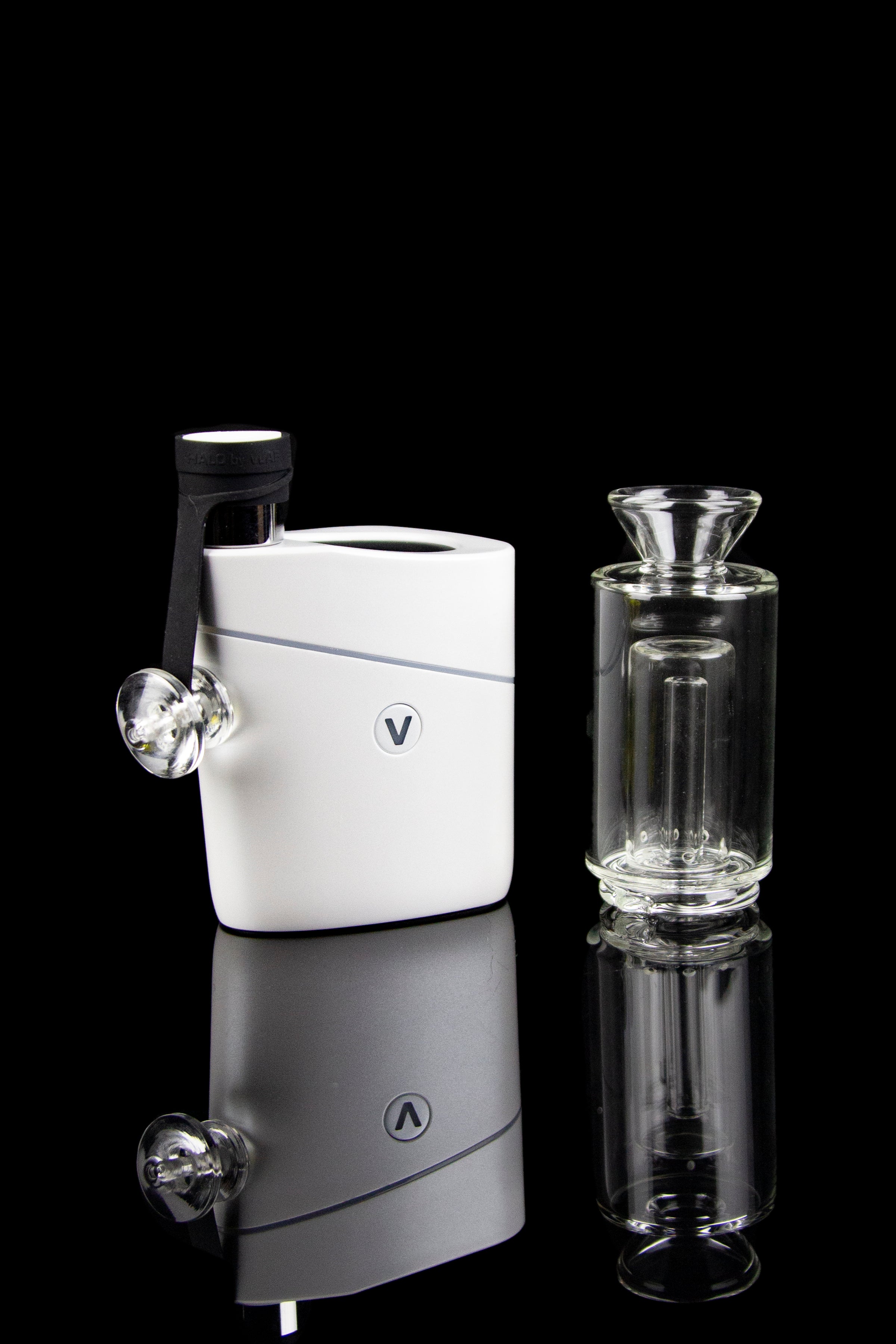 White cannabis e-rig with glass water pipe and mouthpiece, studio shot.