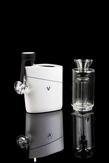 White cannabis e-rig with glass water pipe and mouthpiece, studio shot.