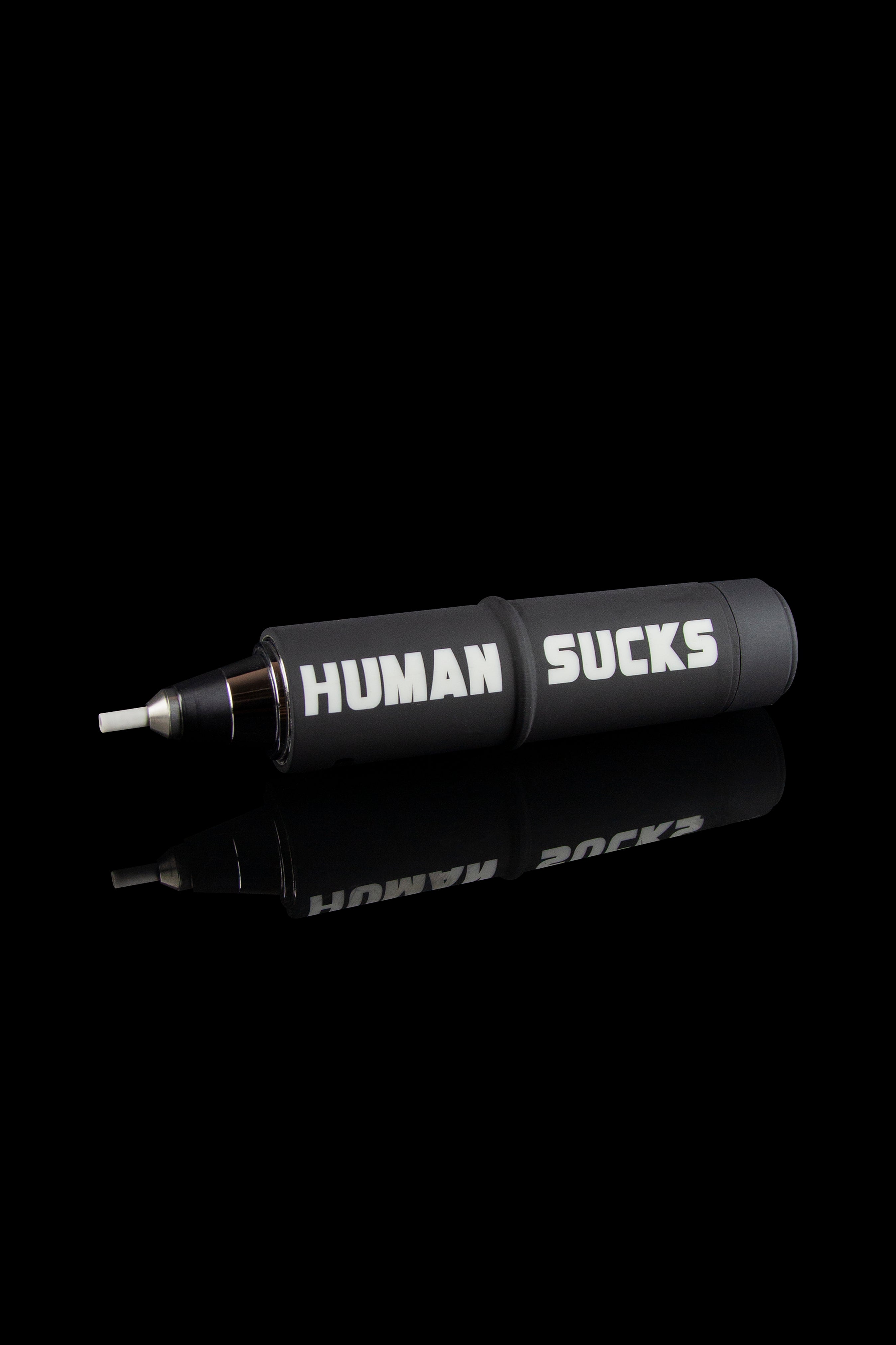 Black cannabis smoking pipe with white text reading “HUMAN SUCKS” displayed on its side.