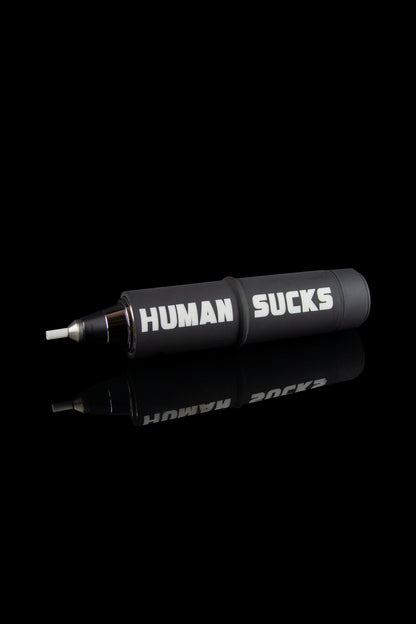 Black cannabis smoking pipe with white text reading “HUMAN SUCKS” displayed on its side.