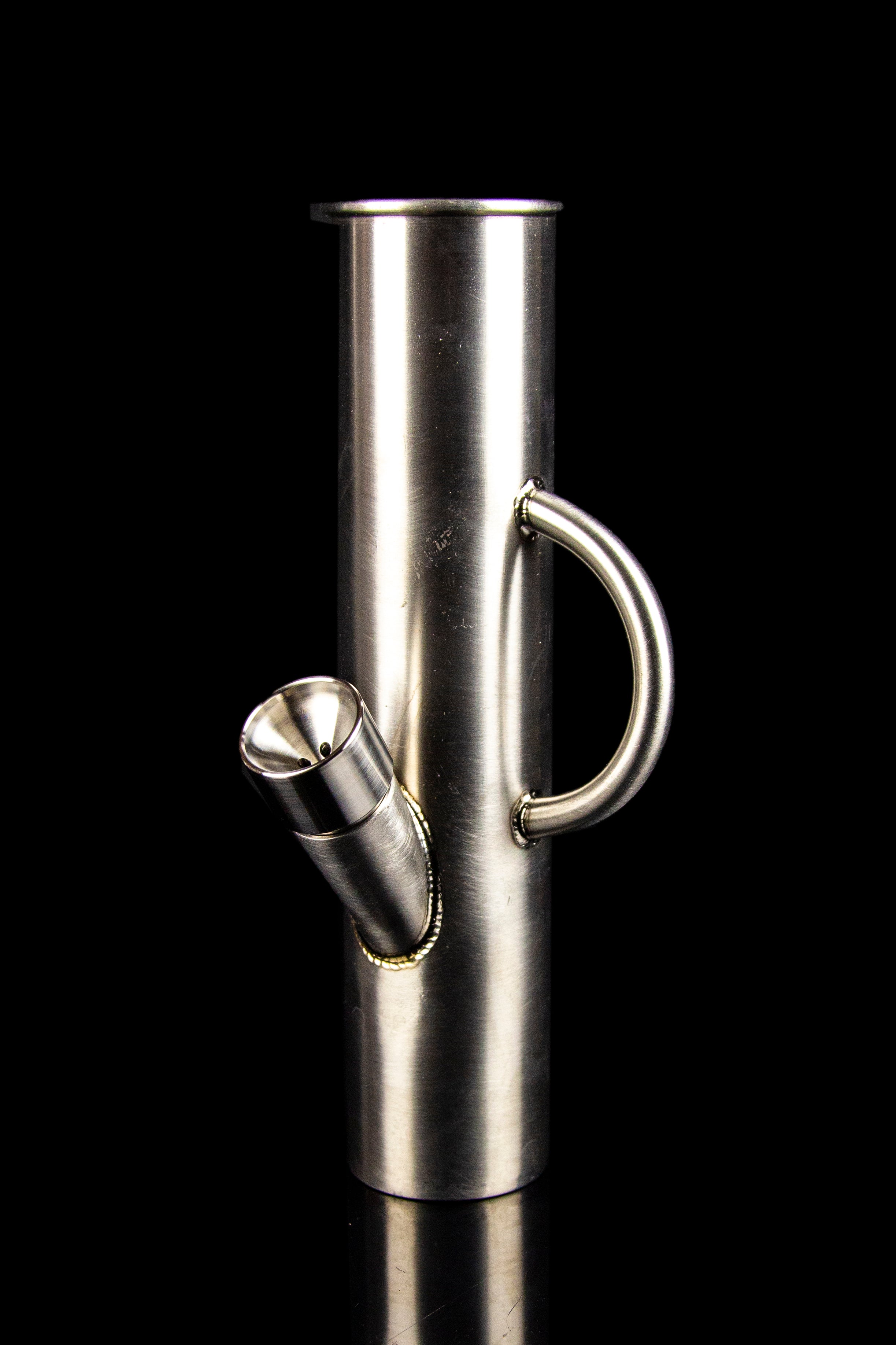 Polished metal cannabis pipe with a looped handle, studio shot on black.