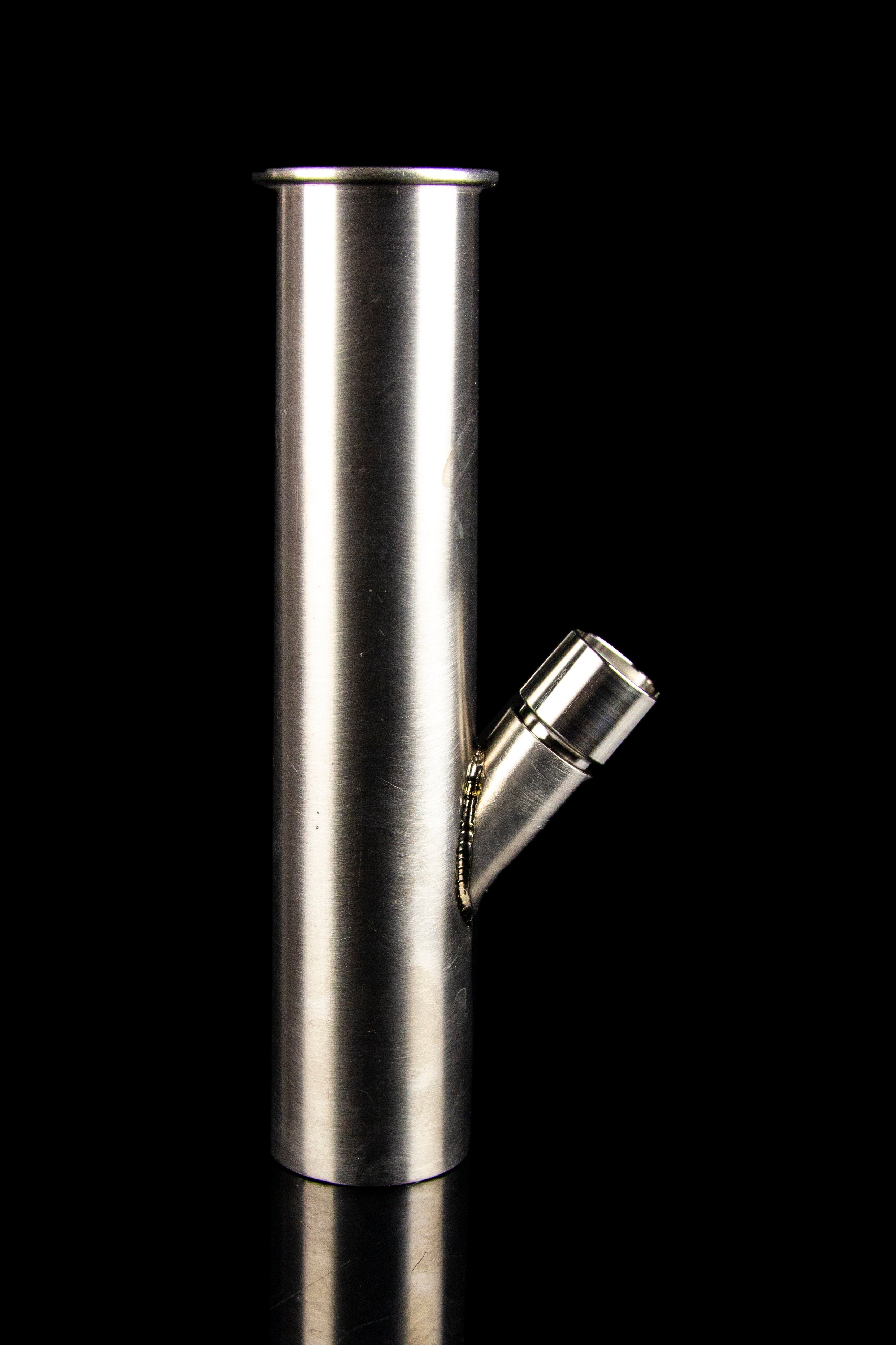 Metal cannabis pipe with a side-mounted bowl, studio shot on black.