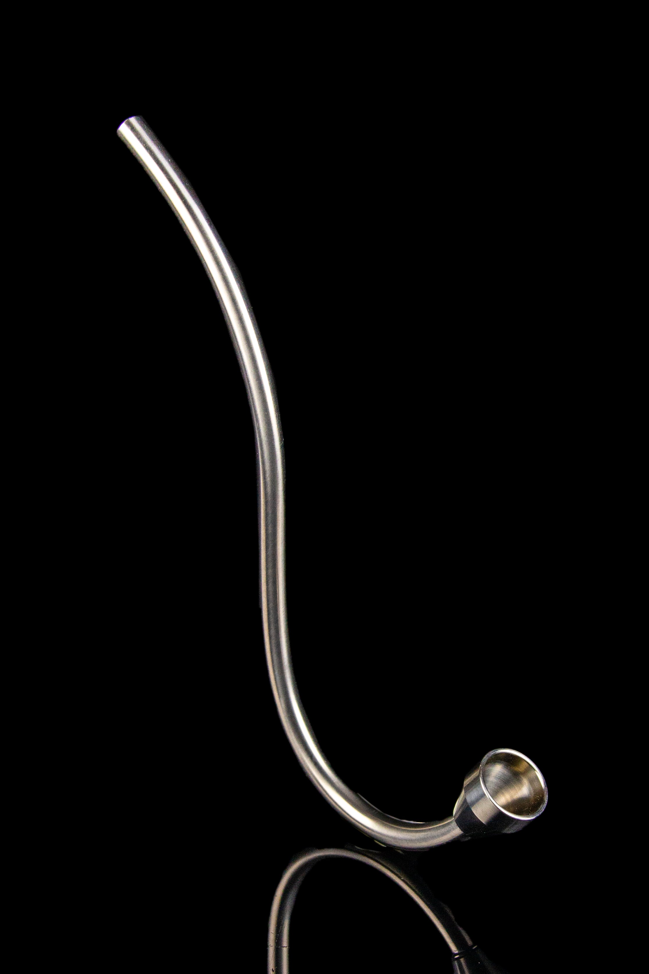 Silver glass cannabis oil burner pipe with a flared mouthpiece, isolated on black.