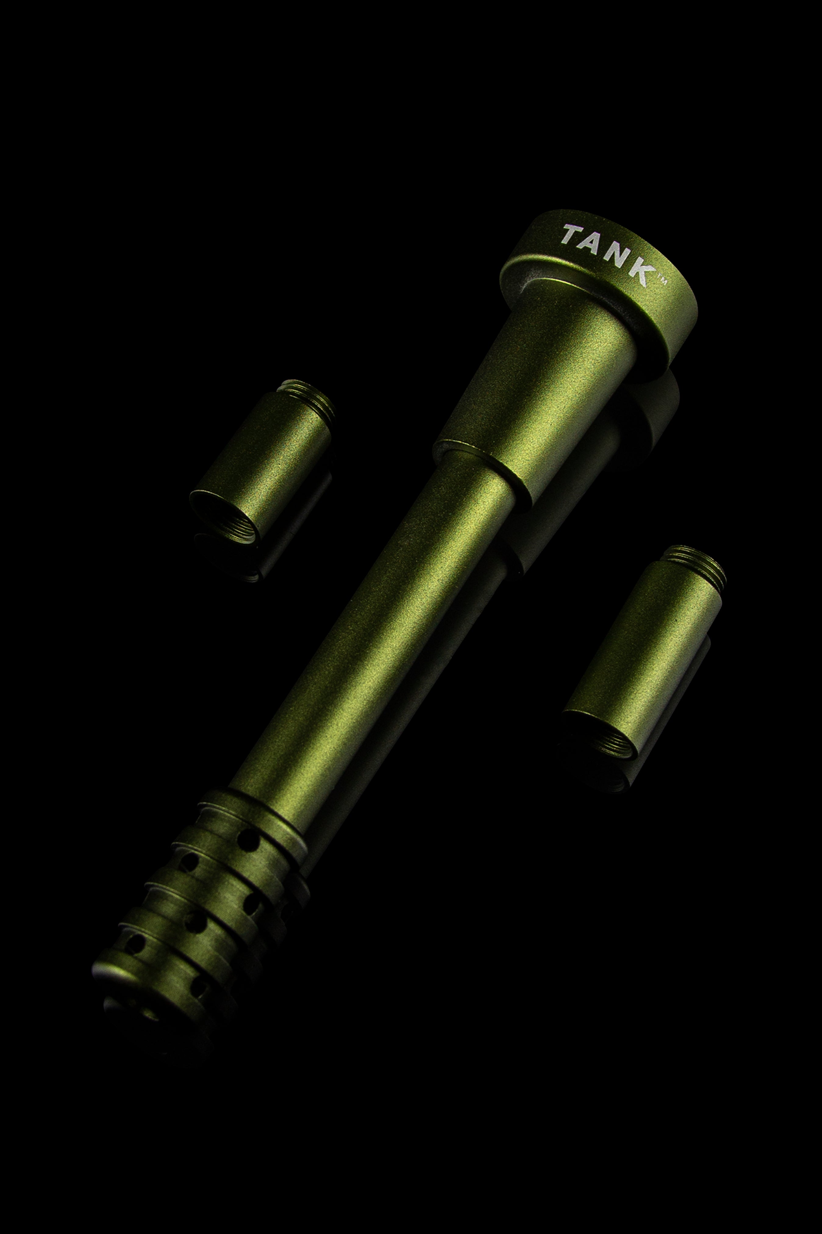 Olive green cannabis oil vape pen components against a black background, labeled “TANK™”.