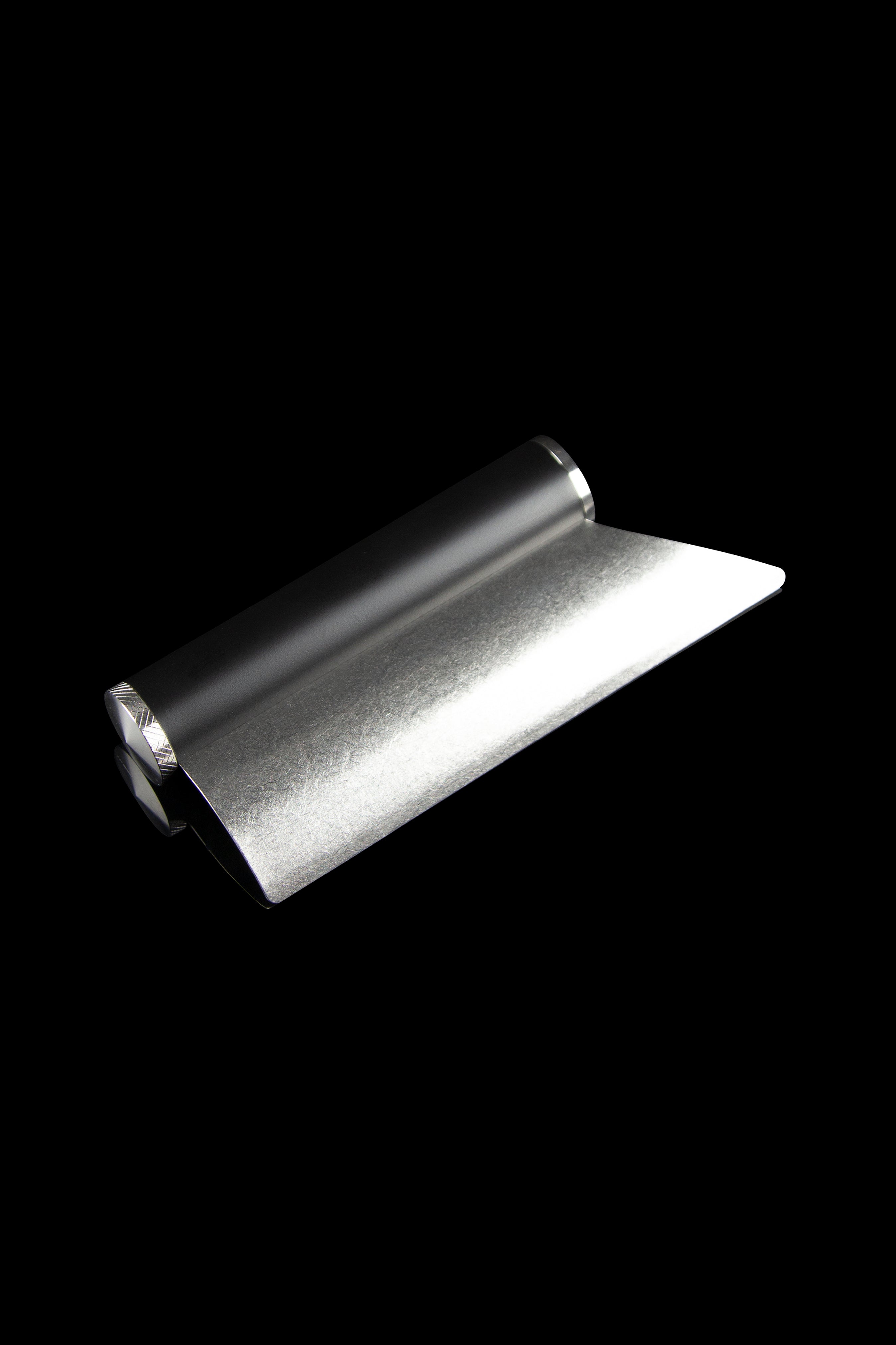 Sleek metal rolling tray for cannabis.