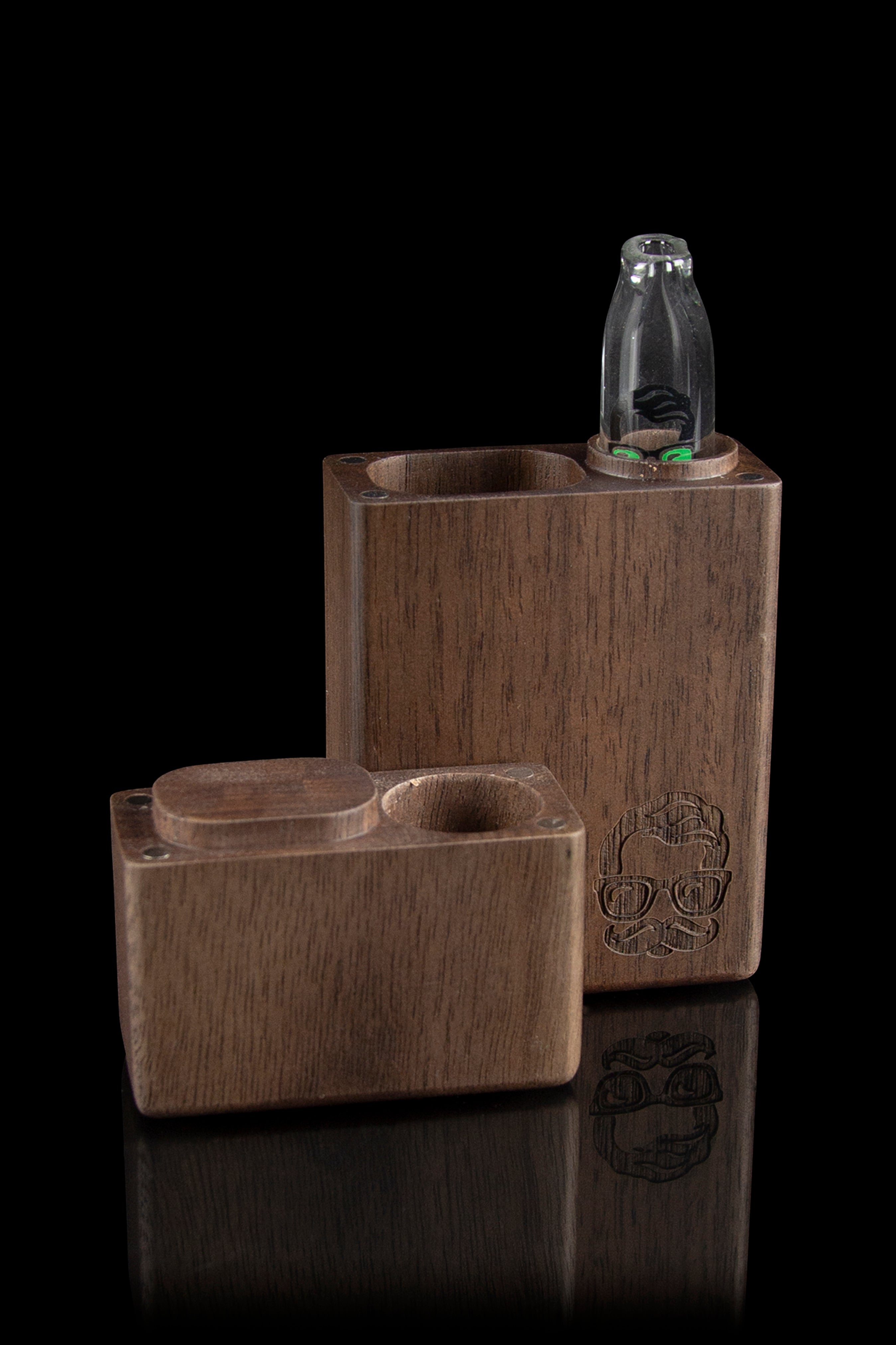 Wooden cannabis smoking box with a glass bubbler, featuring a carved design and reflective surface.