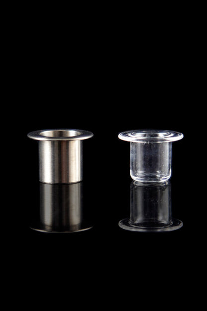 Two metal and glass inserts for dabbing cannabis concentrates, displayed against a black background.