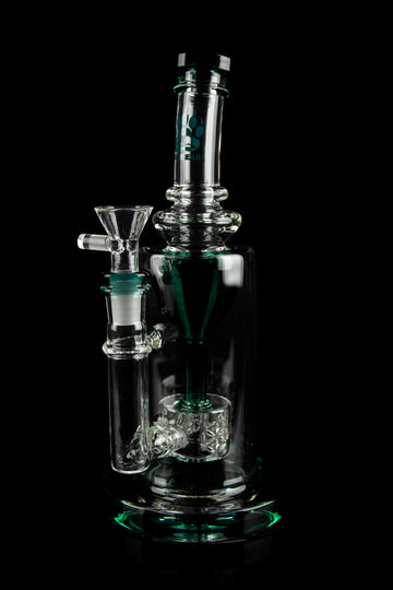 Clear glass water pipe (bong) with green accents, featuring a complex percolator and bowl piece, against a black background. - Calibear "Sundae Stack" Torus Recycler Water Pipe