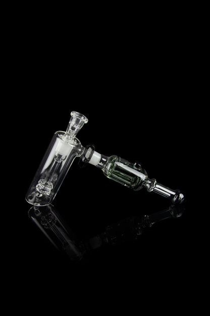Glass rig with bubbler and connection for dabbing, isolated on black.