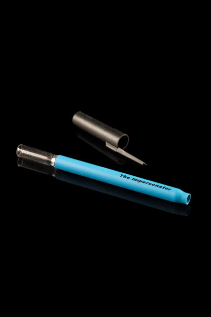 Blue glass cannabis oil burner pipe with a metallic tip and cap, against a black background.