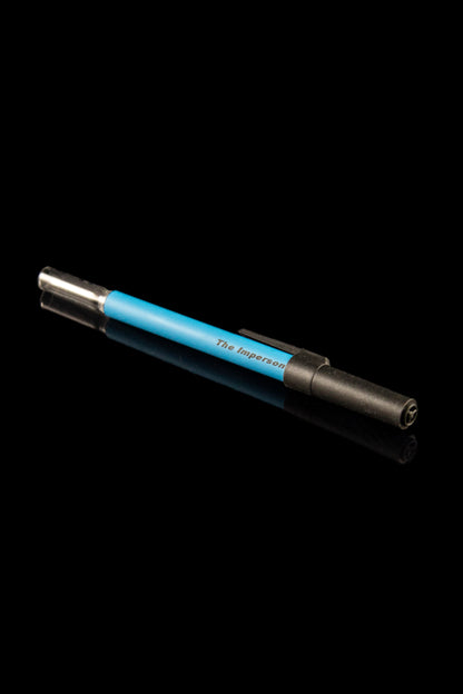 Blue and black cannabis dab pen against a black background.