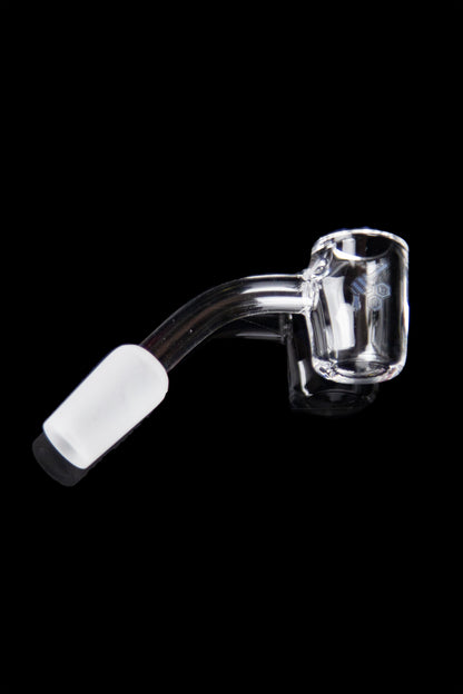 Clear quartz dab nail with a white ceramic insert, isolated on a black background.