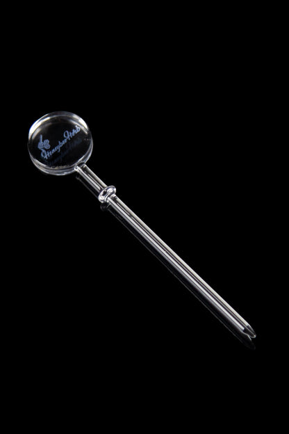 Clear glass dab tool with a rounded, bulbous tip and branded logo, isolated on a black background.