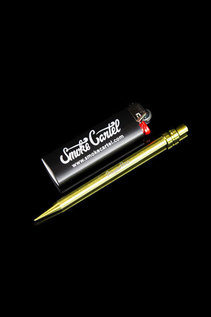 Gold cannabis dab tool and lighter displayed in a branded box.