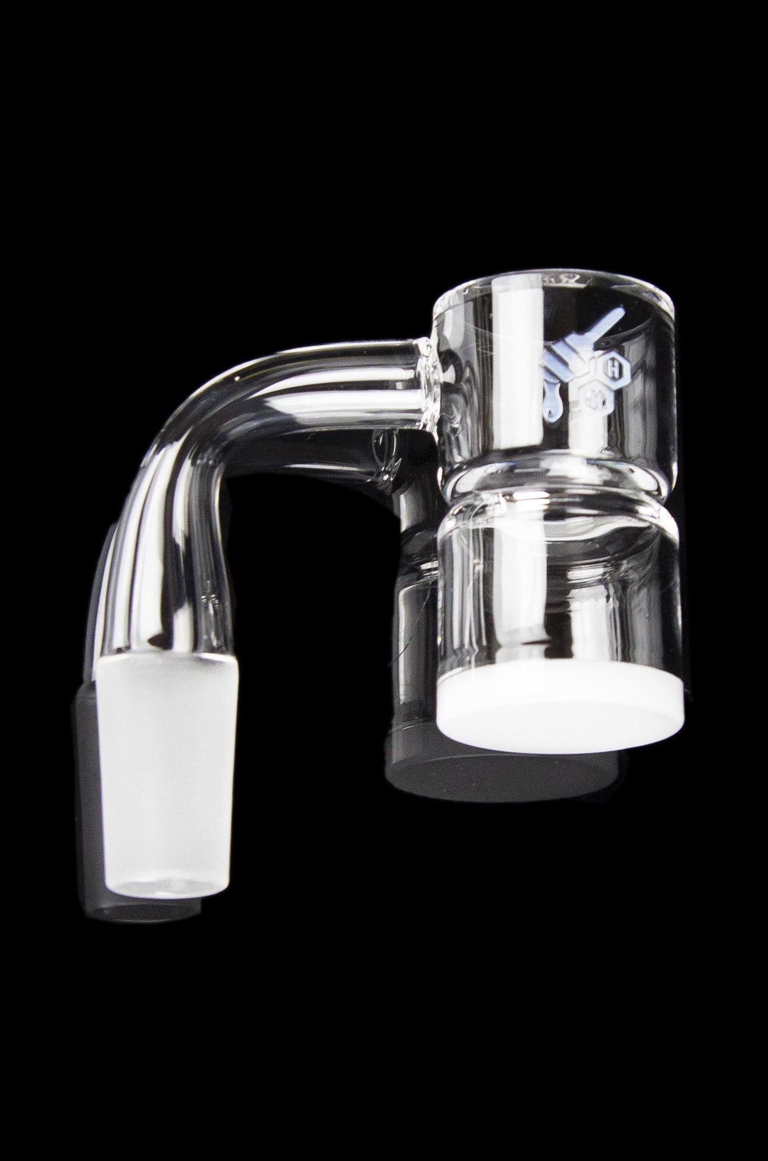 Clear glass dab rig with water filtration, isolated on a black background.