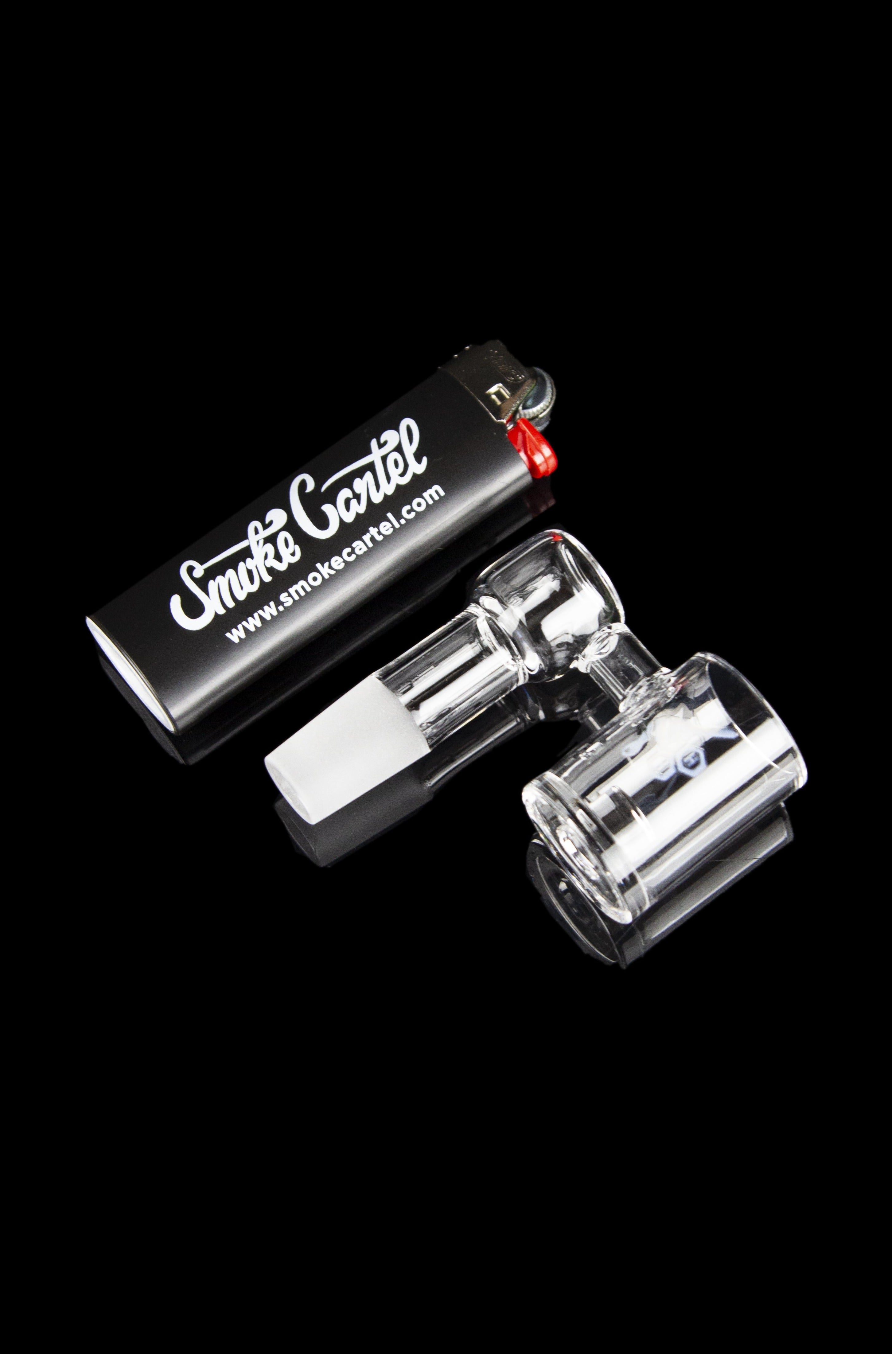 Glass smoking piece and accessories on a black background with branding.