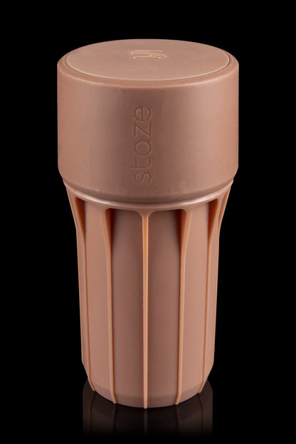 Silicone cannabis container with embossed logo, studio shot."