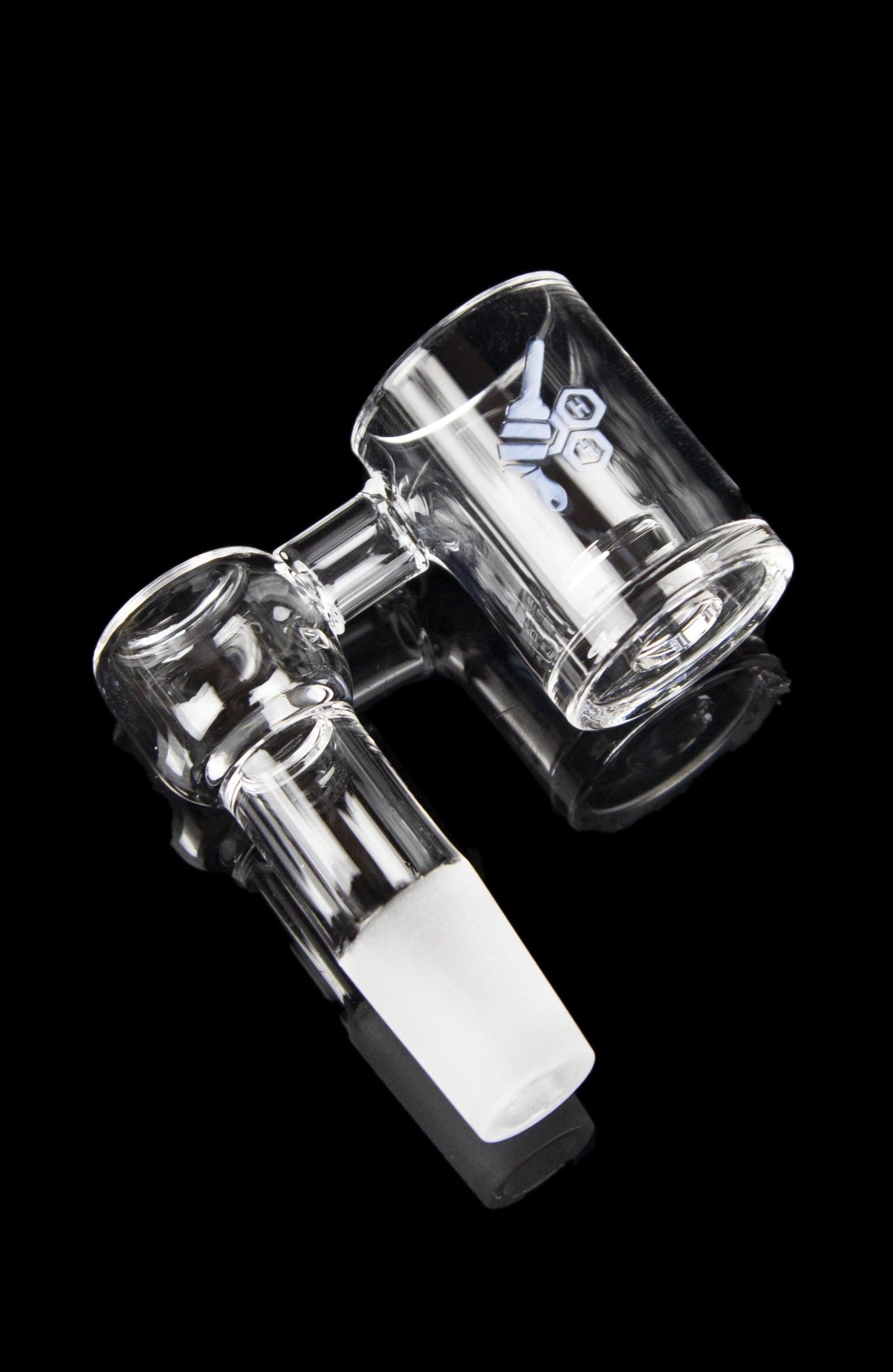 Clear glass dab rig with intricate percolator design, isolated on a black background.