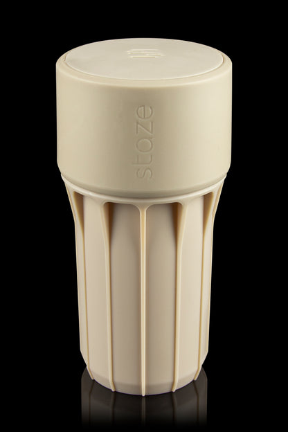 Beige Stoze cannabis container with a textured, ribbed body and airtight lid.