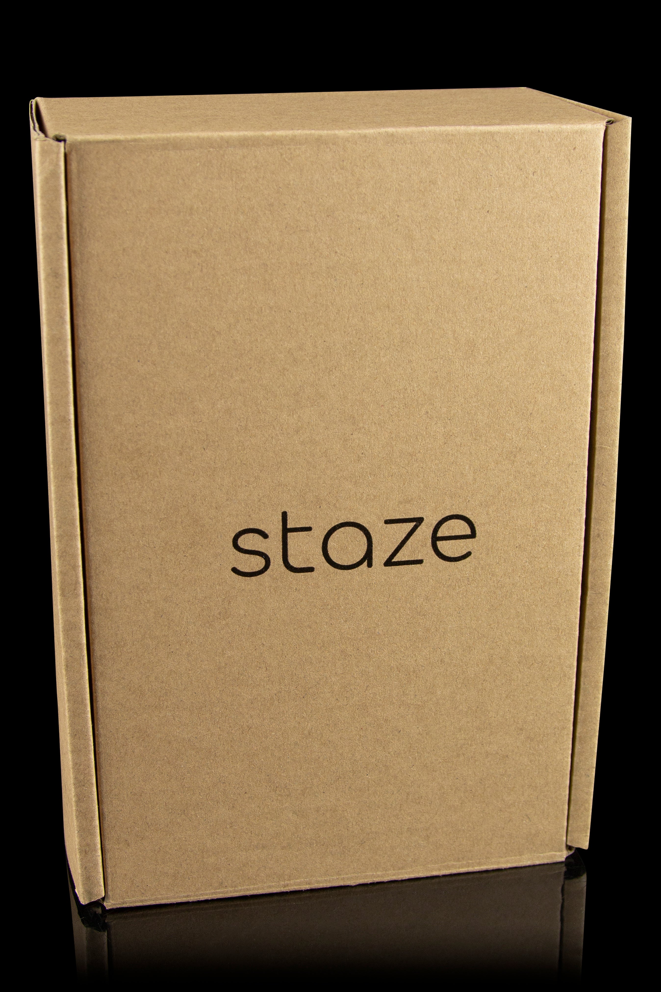 Cardboard shipping box with the brand name "staze" printed in black.