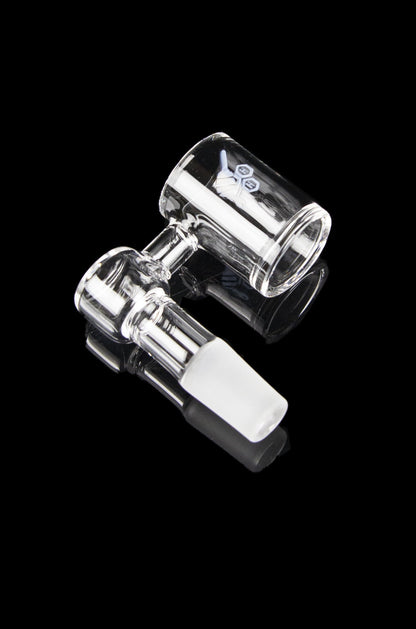 Clear glass dab rig with accompanying carb cap, isolated on a black background.