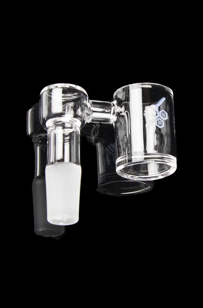 Clear glass bubbler for smoking cannabis, isolated on a black background.