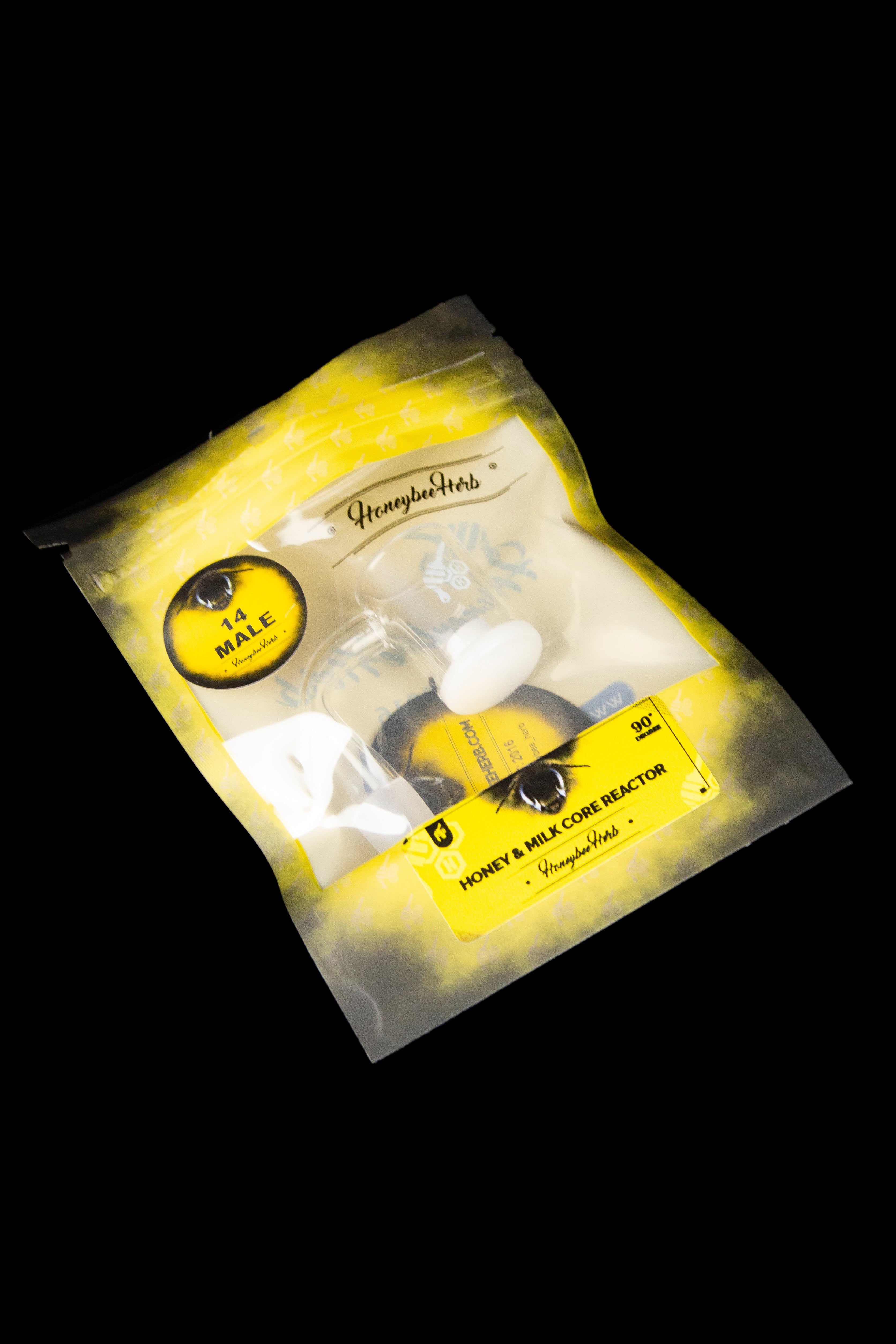 Yellow and black packaging for “Honey & Milk Core Reactor” cannabis accessory from Honeybee Herbs, featuring a bee illustration and branding.