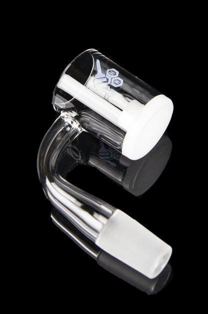 Clear glass dab rig with black accents, isolated on a black background.