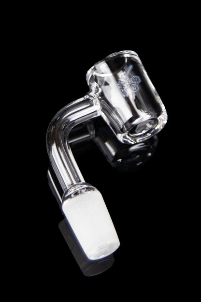Clear glass dab rig nail with a bent design and angled tip, isolated on a black background.
