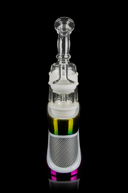 Glass dab rig with colorful accents and a metallic base, isolated on a black background.