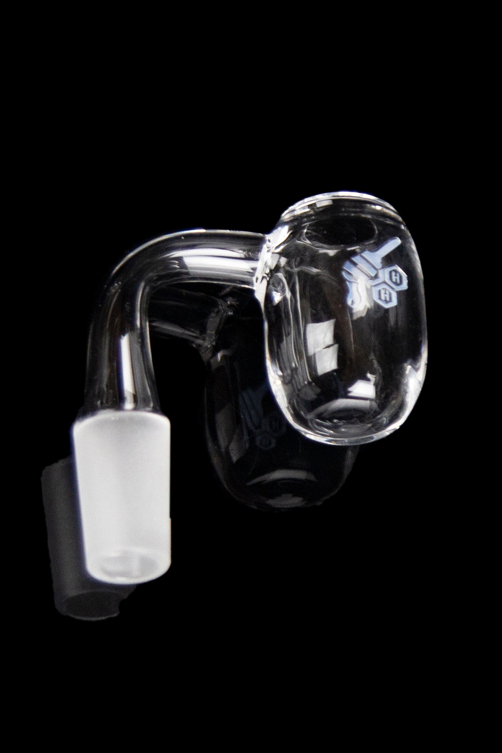 Clear quartz dab rig nail with ceramic insert against a black background.