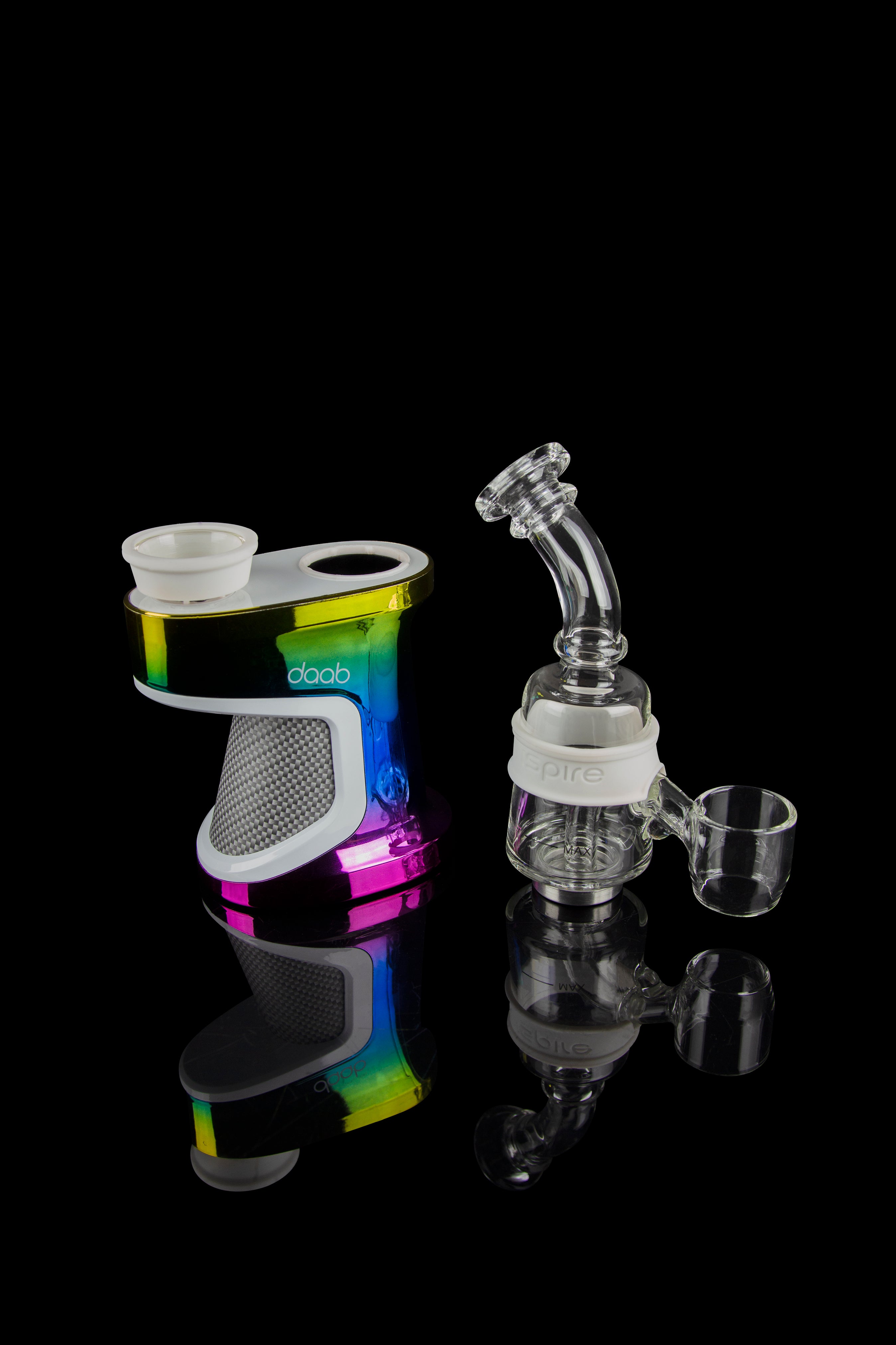 Daab cannabis e-rig with various glass attachments displayed on a reflective surface.