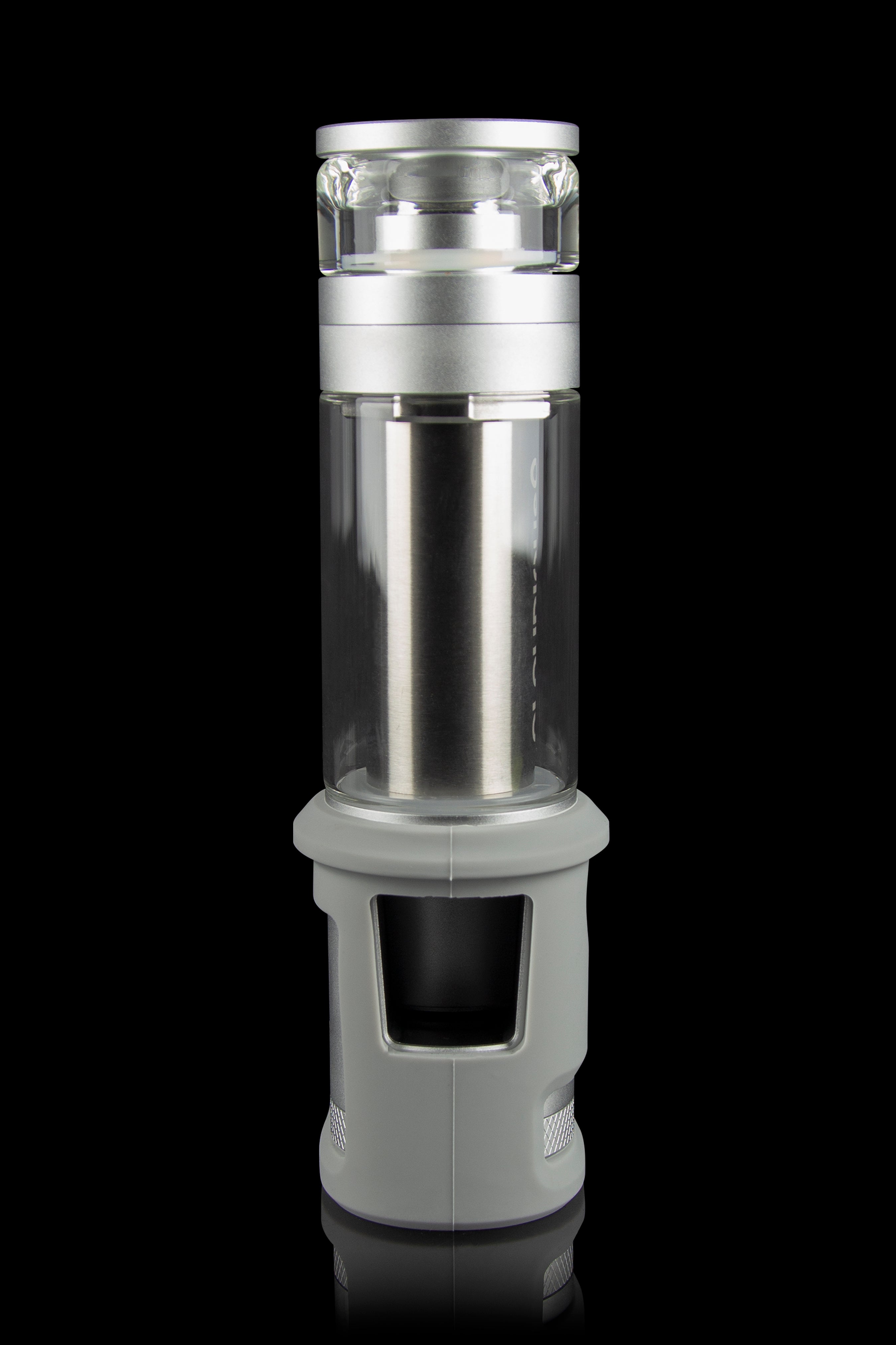 Silver cannabis water pipe with a cylindrical glass chamber and textured base, isolated on a black background.
