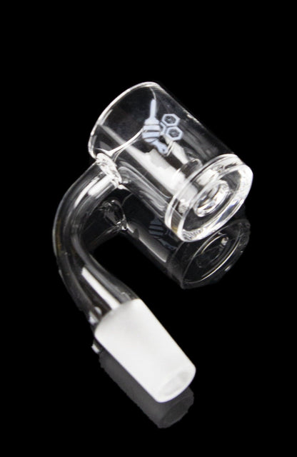 Clear quartz banger with a white and black handle, used for vaporizing cannabis concentrates.